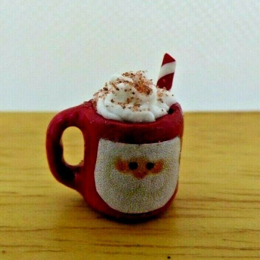 Miniature santa mug with whipped cream and straw